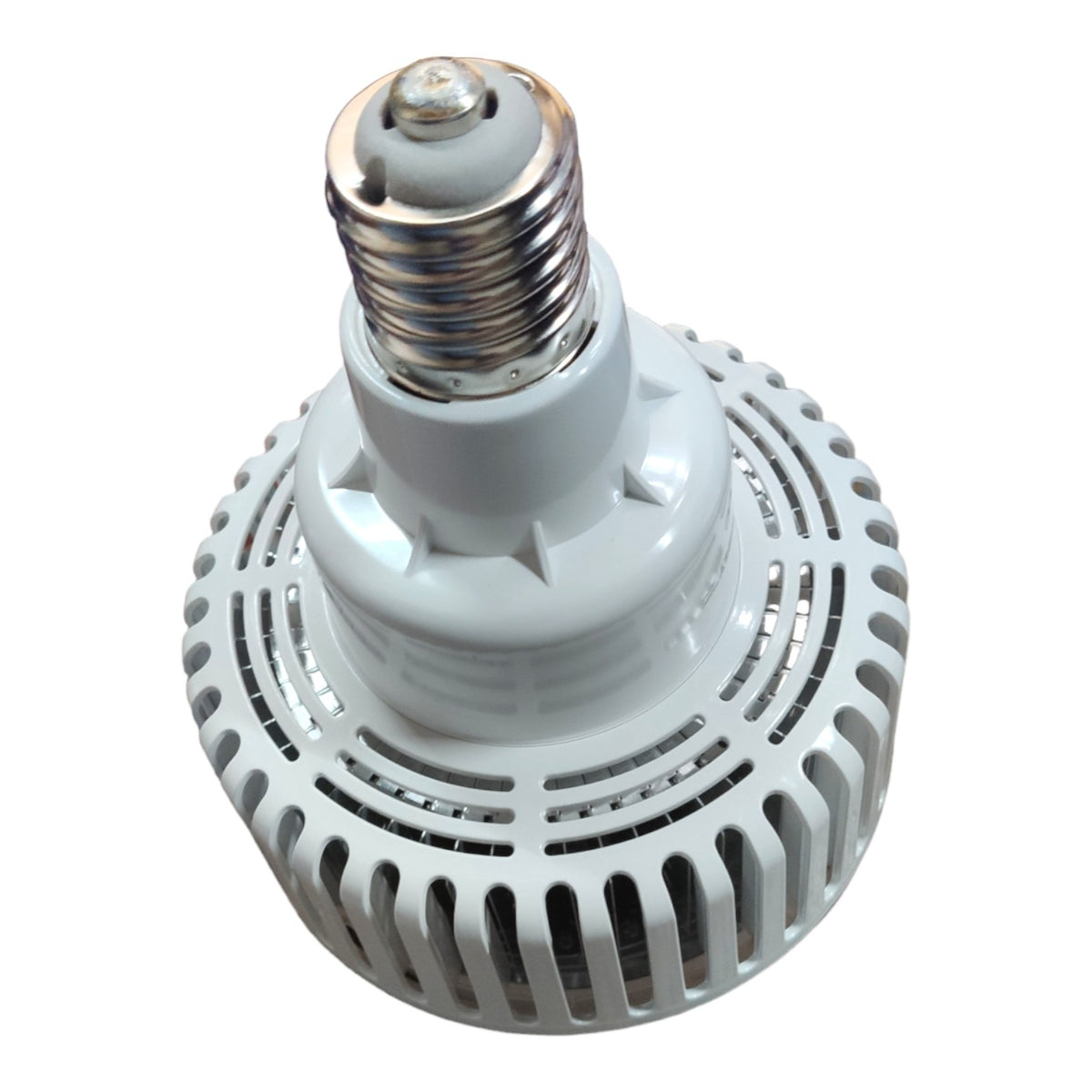A white LED light bulb with a ribbed heat sink and a silver screw base, shown on a plain white background.