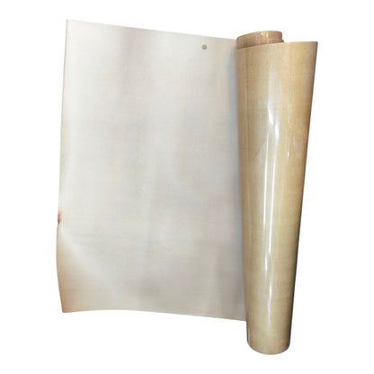 A roll of translucent beige adhesive film or vinyl sheet partially unrolled, showing its glossy, slightly wrinkled surface against a plain white background.