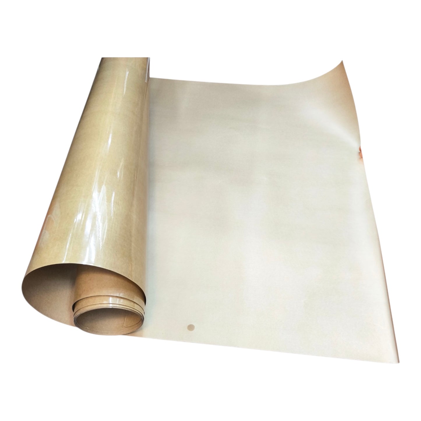 A roll of glossy, light beige adhesive film or vinyl sheet partially unrolled, showing its smooth, reflective surface against a plain white background.
