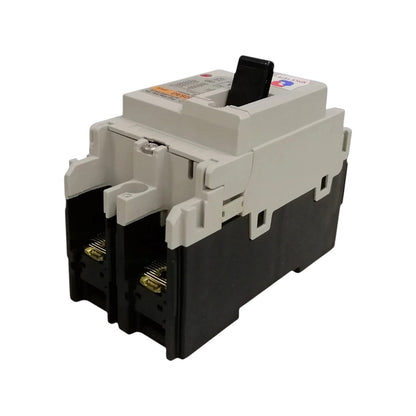A heavy-duty electrical circuit breaker with a black lower housing and a light gray upper casing, featuring a black switch handle on top.