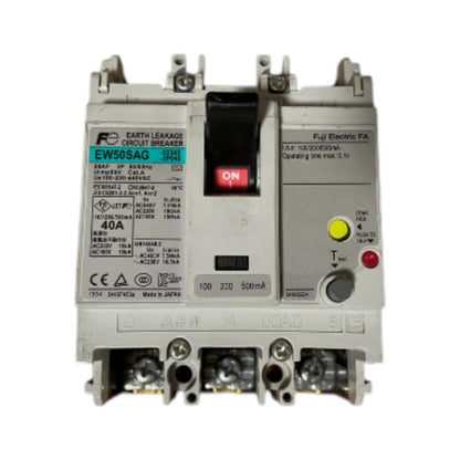 A Fuji Electric circuit breaker with a white plastic housing, featuring a black central handle with a red ON switch, technical specifications printed on the front, and terminal connections at the bottom.