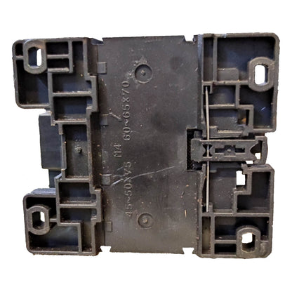 Black plastic component with text and markings on a white background