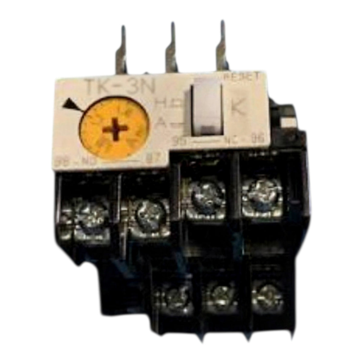 An industrial electrical contactor with a black plastic body, silver metal terminals, a white reset switch, and a yellow polarity indicator dial on a white label.