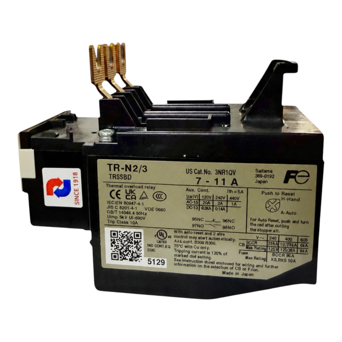 A black automotive battery with a large white specification label on the front, gold-colored terminal posts, and a small red and white 'SINE R&D' sticker on the side, photographed against a plain white background.