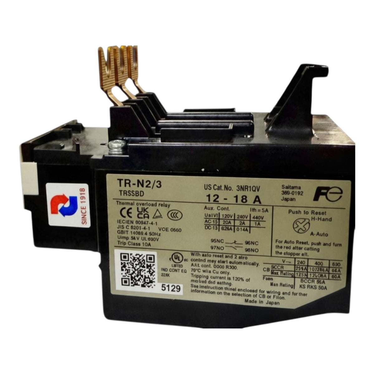 A black electrical relay component with gold-toned terminal posts and a white specification label on the front, photographed on a plain white background.