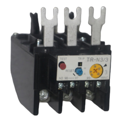 A black thermal overload relay with three silver metal terminal posts and a white control label showing test, trip, and reset markings.