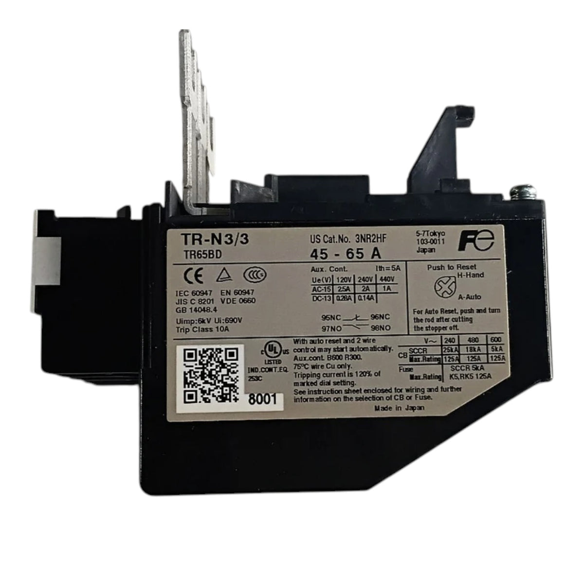 A black industrial battery with a white label showing technical specifications and a QR code, photographed on a white background.