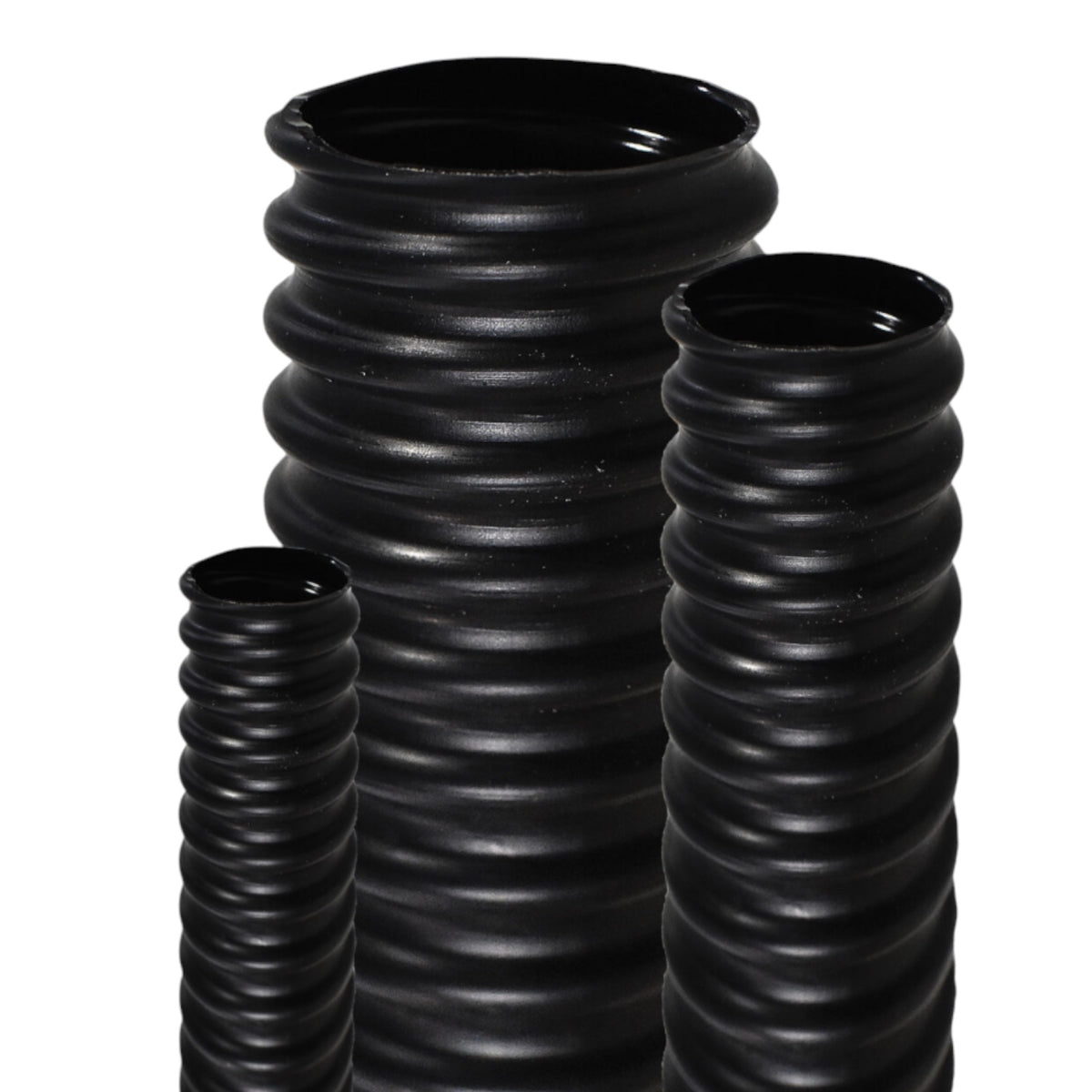 Three black ribbed flexible plastic tubes of different heights, arranged on a plain white background.