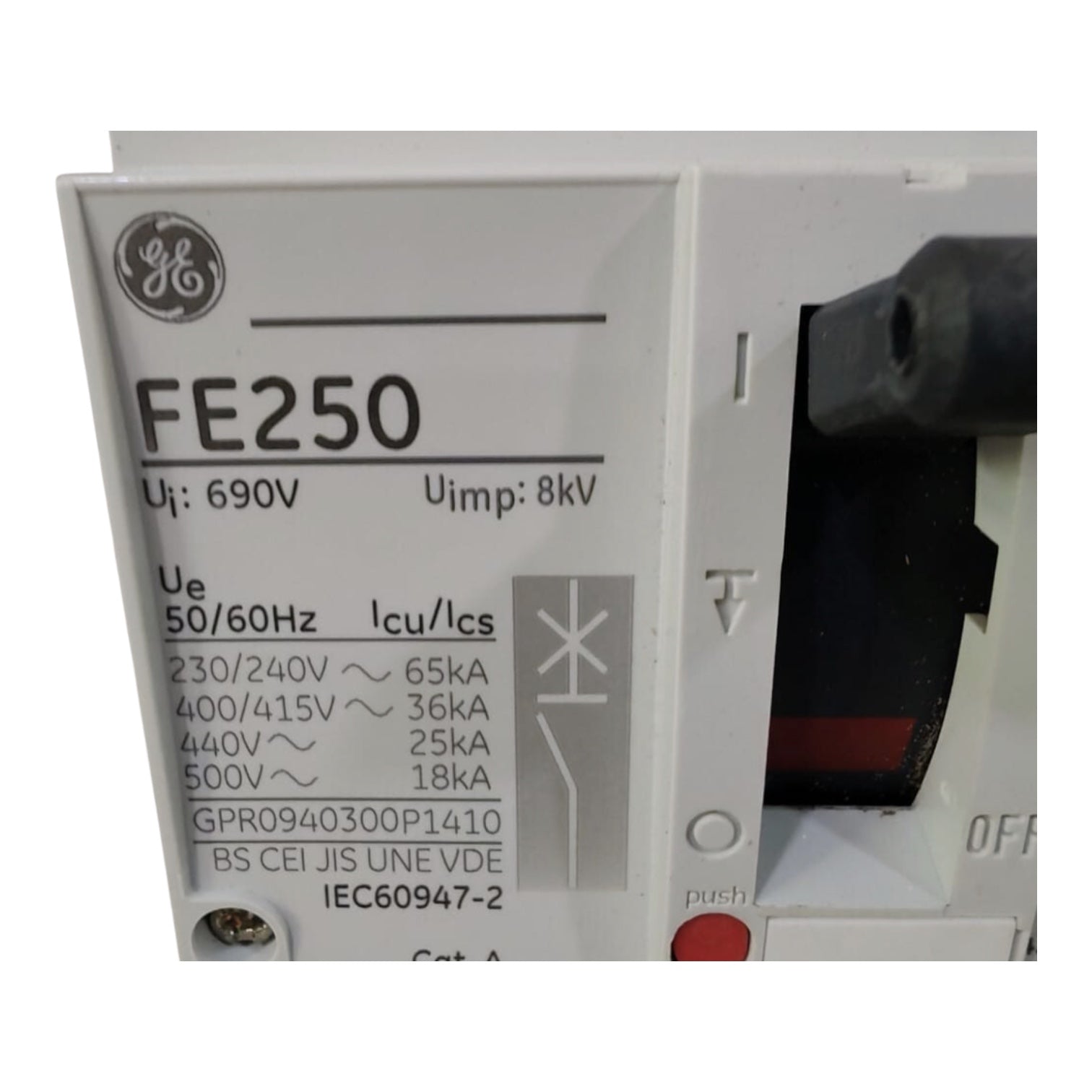 A GE FE250 circuit breaker shown in a close-up product shot. The white plastic front panel features black printed specifications and the GE logo, with a black handle visible on the right side.