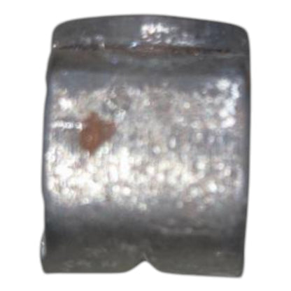 Metallic object with a brown spot on a white background