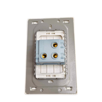 A 3-pin modular electrical terminal block with gold-plated screw contacts, mounted on a white plastic carrier and a gray metal backplate.