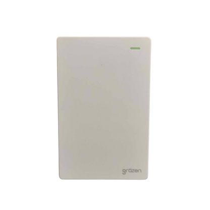 A white Citizen electronic power supply or module with a small green LED indicator light on the top right and the 'citizen' logo printed in gray at the bottom right, shown against a plain white background.