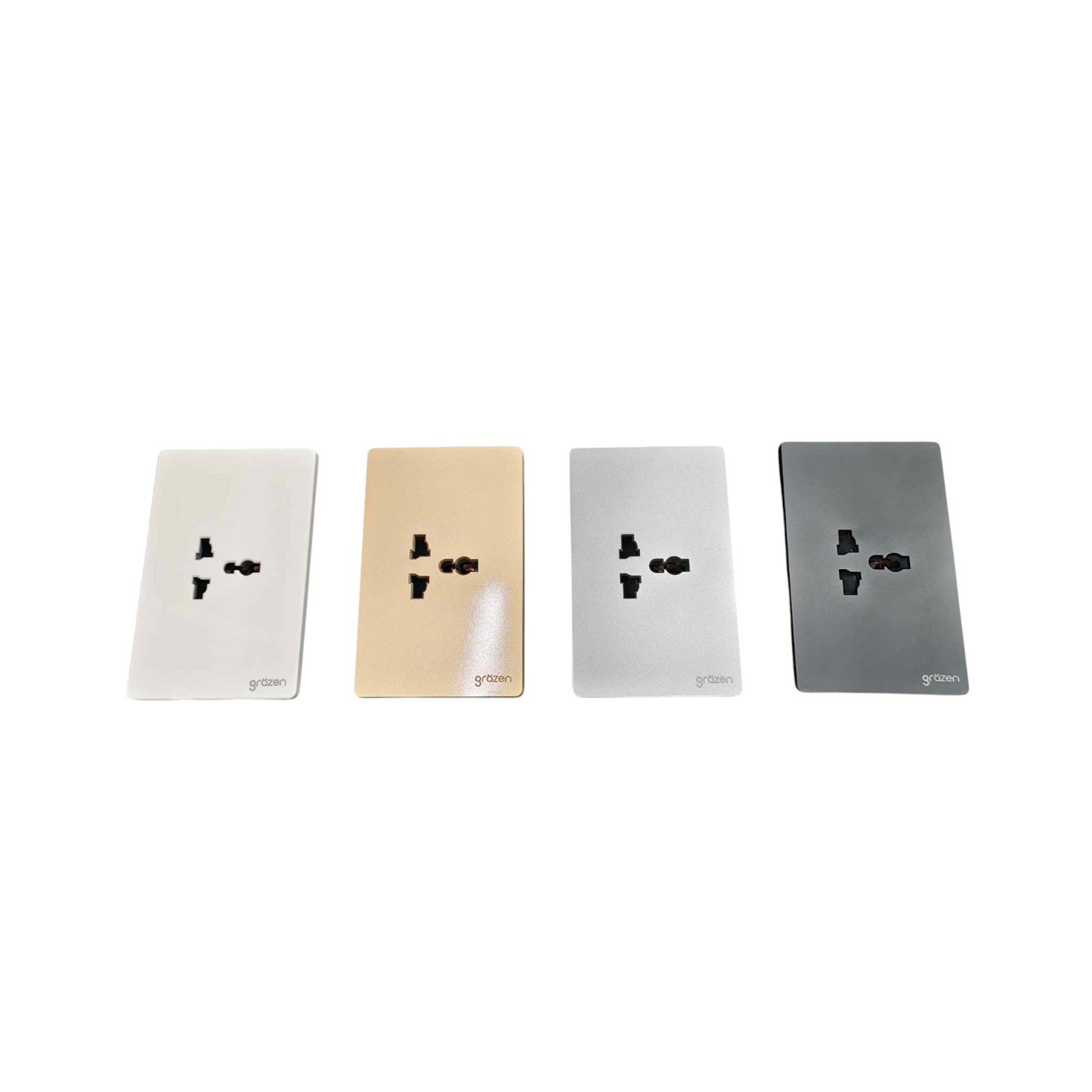 Four rectangular wall outlet covers shown side by side on a white background, in white, champagne gold, silver, and dark gray finishes.