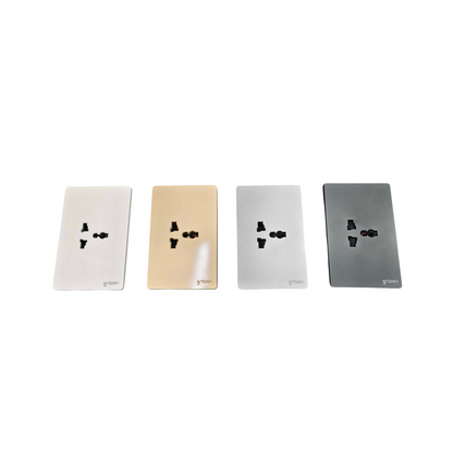 Four rectangular wall outlet covers shown side by side on a white background, in white, champagne gold, silver, and dark gray finishes.
