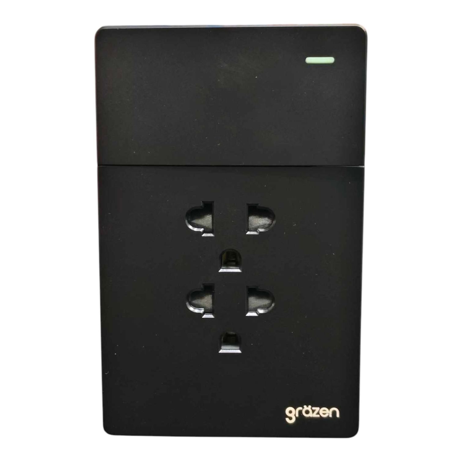 A black Gräzen dual UK wall outlet power strip with a small green LED indicator light on the top right, shown against a plain white background.