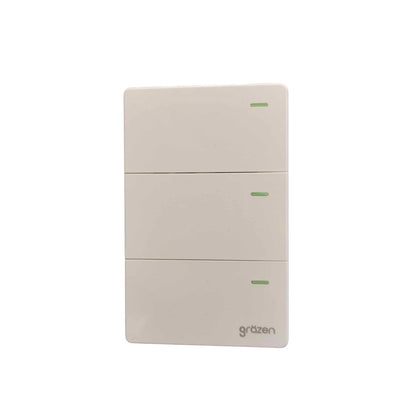 A three-button wall switch panel by Grazen, featuring a minimalist off-white plastic design with small green indicator lights on each button.