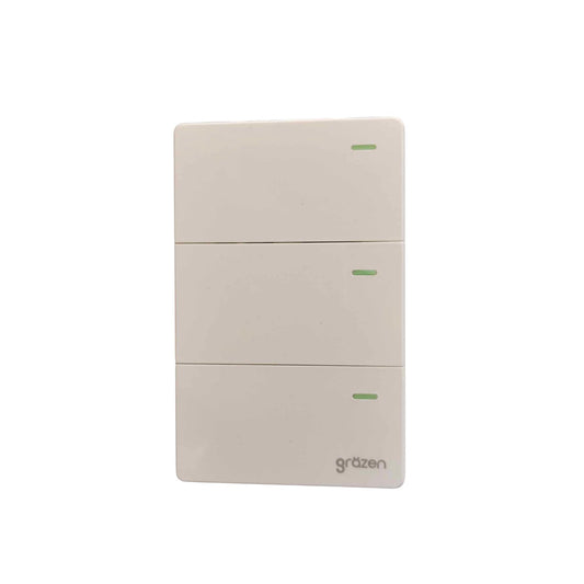 A three-button wall switch panel by Grazen, featuring a minimalist off-white plastic design with small green indicator lights on each button.