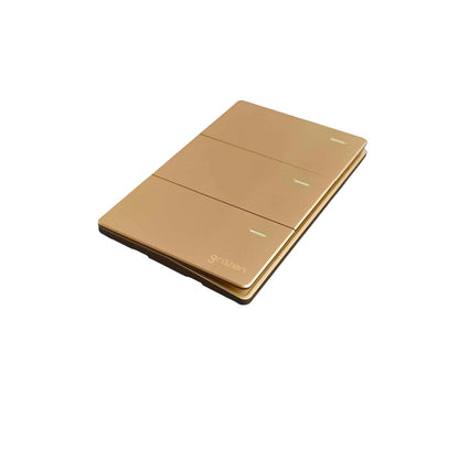 A three-button wall switch panel in a brushed gold finish, shown at an angle on a plain white background.