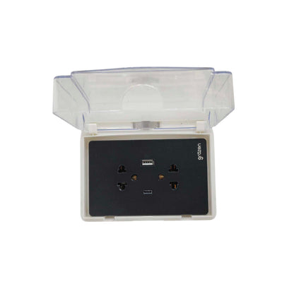 A waterproof outdoor wall outlet socket with a transparent protective cover, featuring a black faceplate with multiple outlets and a USB port.