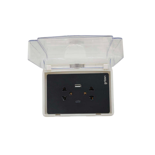 A waterproof outdoor wall outlet socket with a transparent protective cover, featuring a black faceplate with multiple outlets and a USB port.