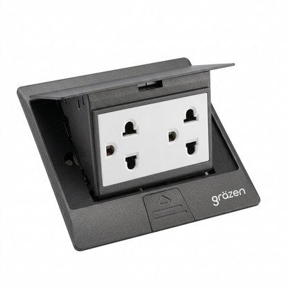 A black outdoor waterproof double outlet socket cover with a white double AC power plug visible inside, featuring the 'grözen' brand logo on the front base.