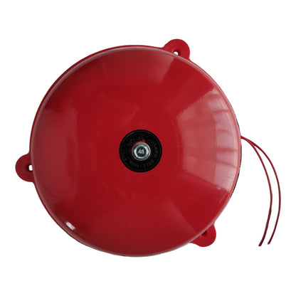 A glossy red circular bell with a black central dial and two red hanging cords, photographed on a plain white background.