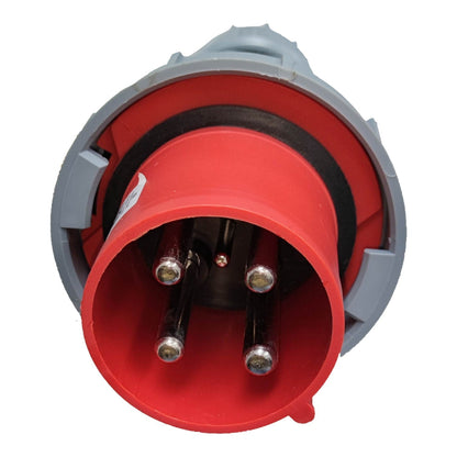 Red electrical plug with gray casing on a white background