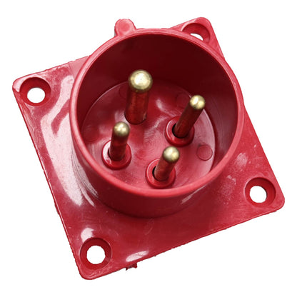 Red electrical connector with gold pins on a white background