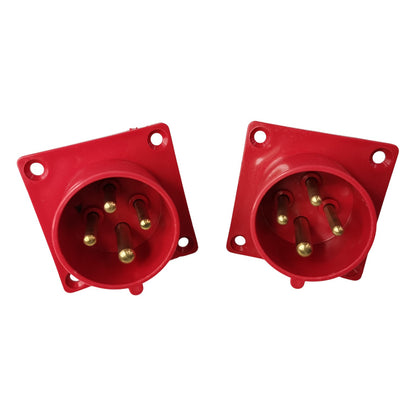 Two red electrical connectors on a white background