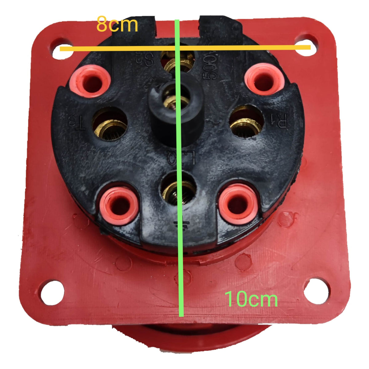 Red electrical connector with black center and measurements indicated on a white background