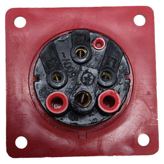 Red electrical socket with metallic connector on a white background