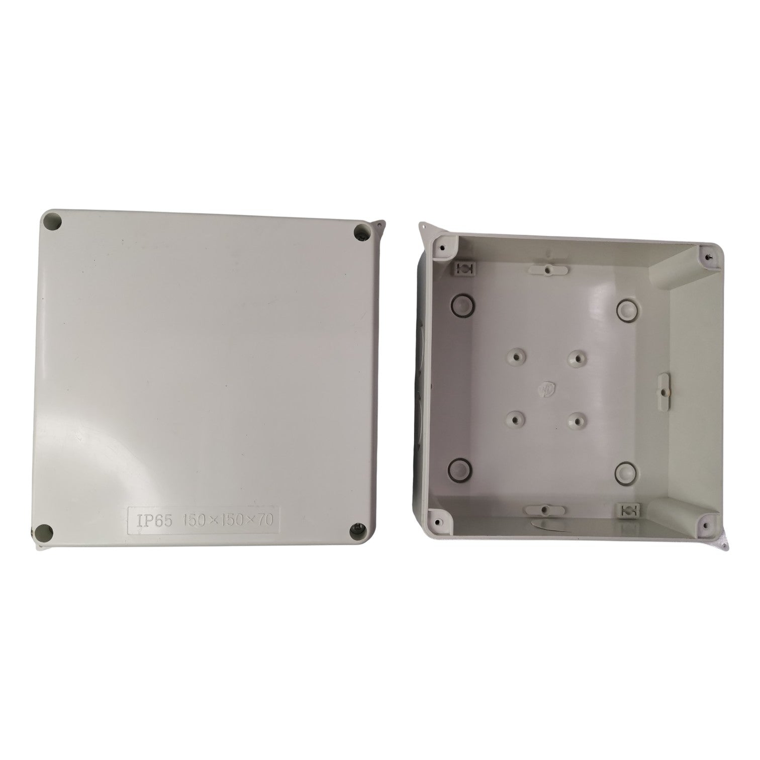 Two metallic boxes with screws on a white background