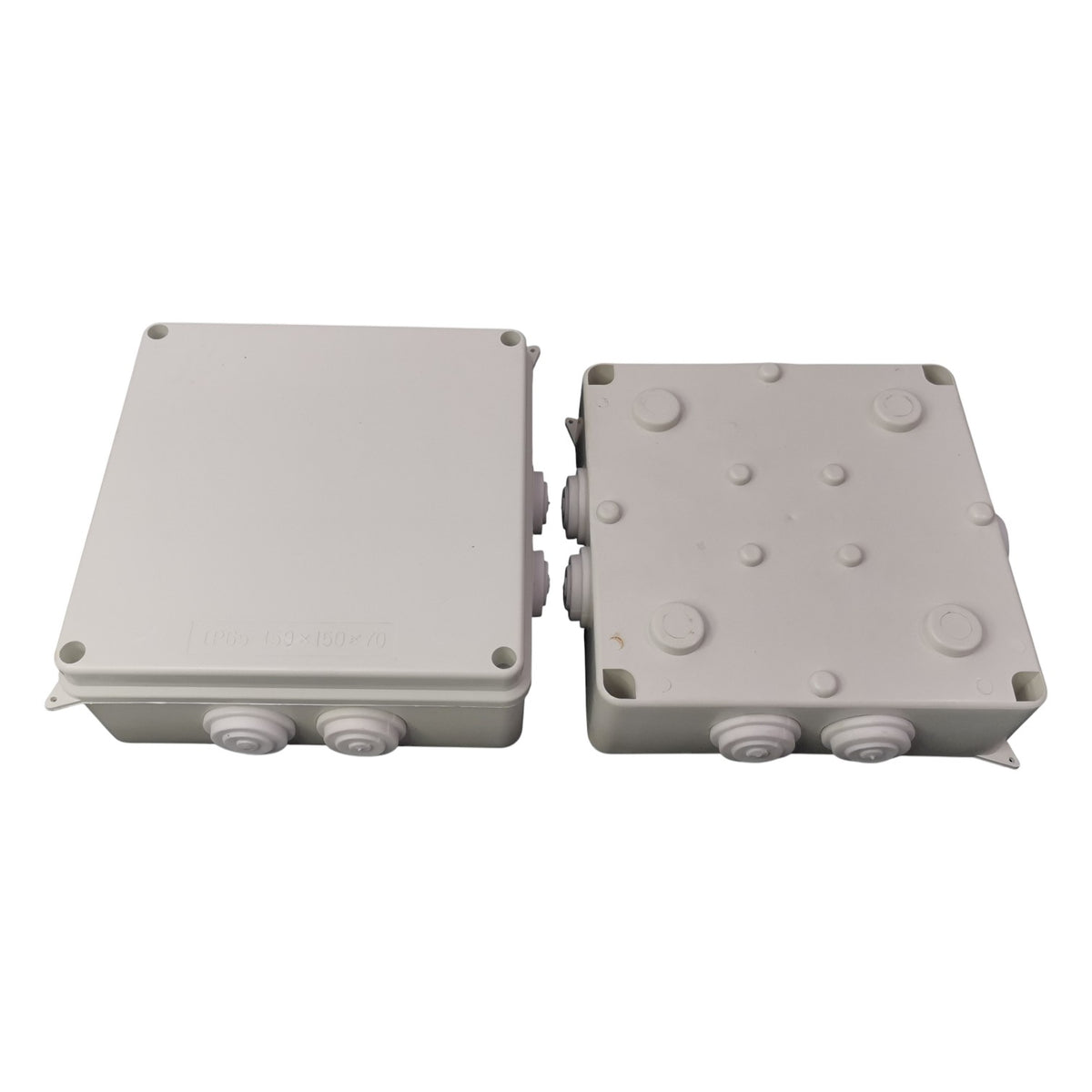 Two gray plastic junction boxes on a white background
