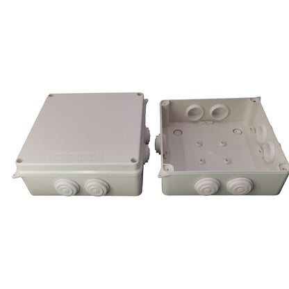 Two gray electrical junction boxes on a white background