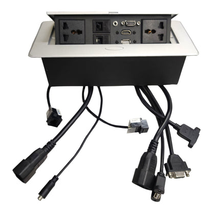 An under-desk power strip with a silver top panel and black base, shown with multiple black power cords and adapters extending downward on a white background.