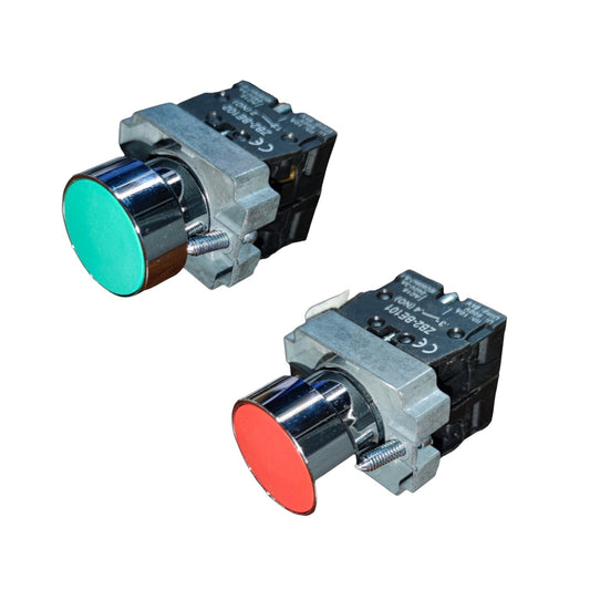 Two industrial push-button switches with metallic silver bodies, one featuring a green button face and the other a red button face, shown on a plain white background.