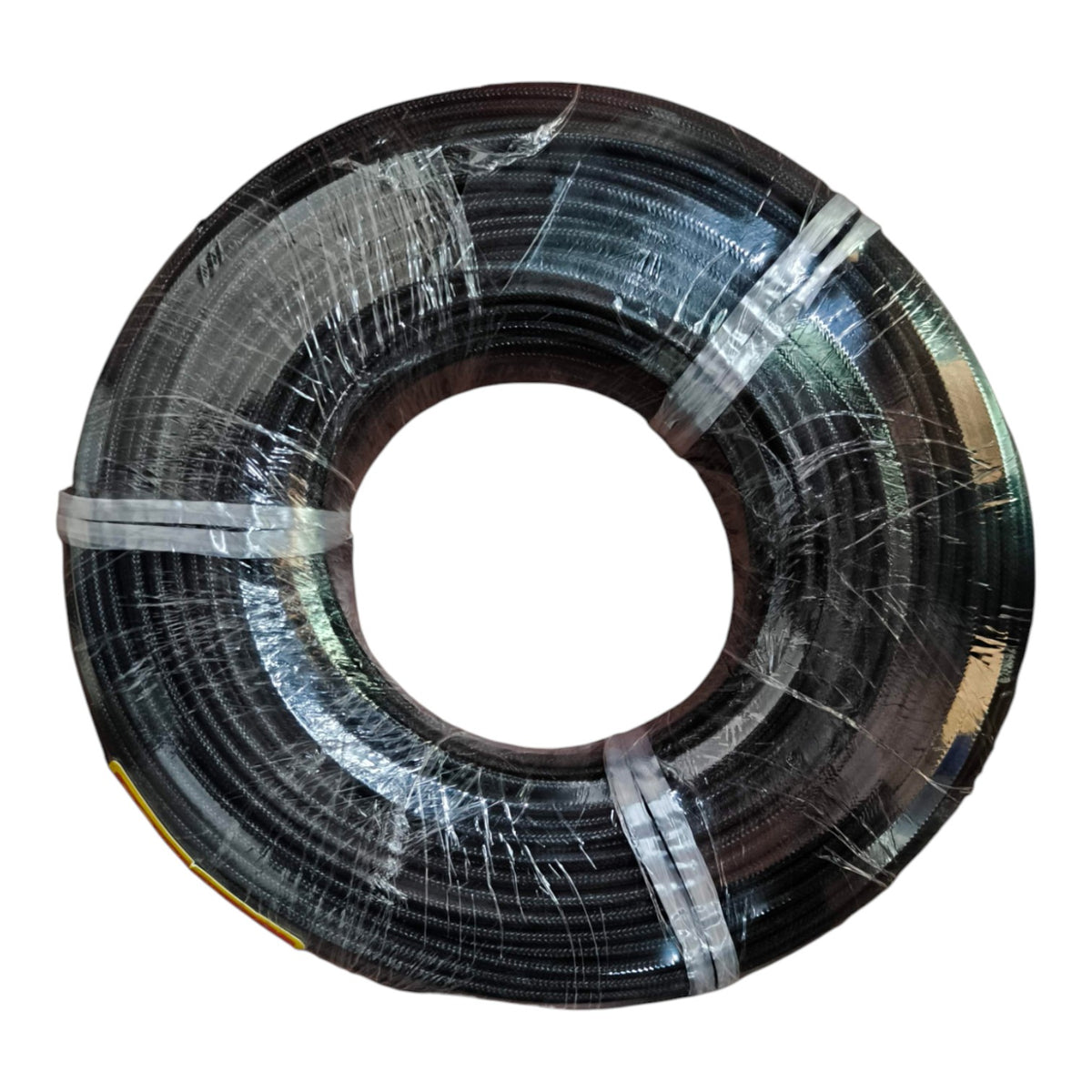 A large spool of black cable or wire wrapped in clear protective plastic, isolated on a white background.