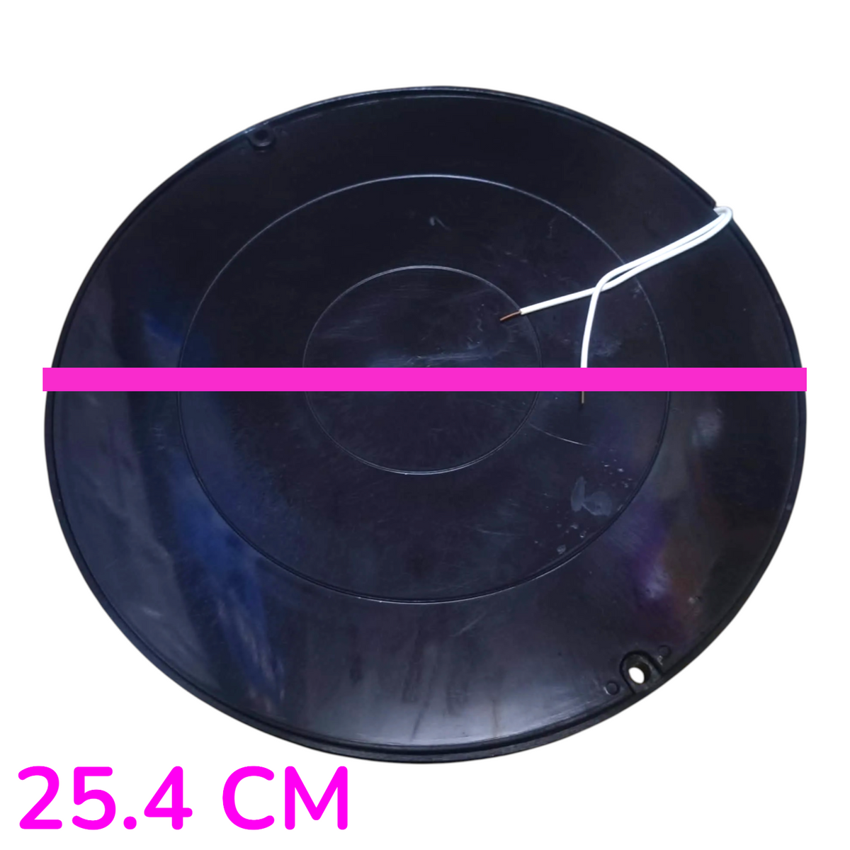 A round black plastic disc or shallow tray shown from above on a white background, with a bright pink horizontal line across the center and pink text reading 25.4 CM at the bottom left to indicate size.