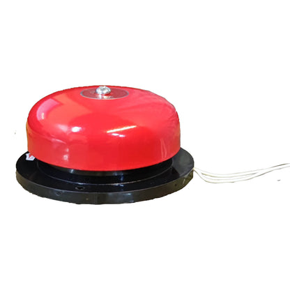 A red dome-shaped bell with a black circular base and visible wire leads, photographed on a plain white background.