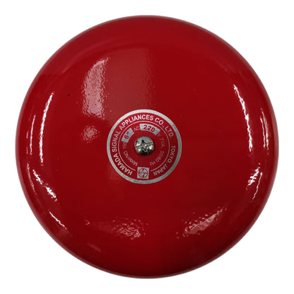 Red bell with a visible brand logo on a white background
