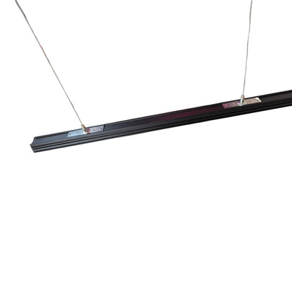 A long, slim black linear light fixture suspended by two thin cables against a plain white background.