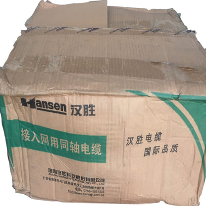 A large corrugated cardboard shipping box printed with the Hansen brand name and Chinese text, including '汉胜' and '接入网用同轴电缆'.