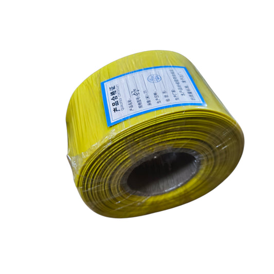 Roll of yellow material with a label on a white background