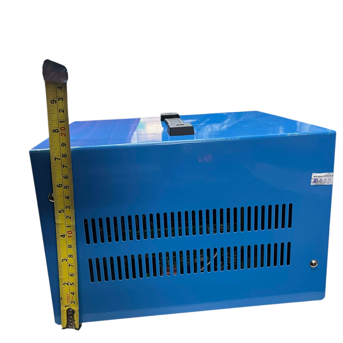 Blue electronic device with a measuring tape for scale on a white background