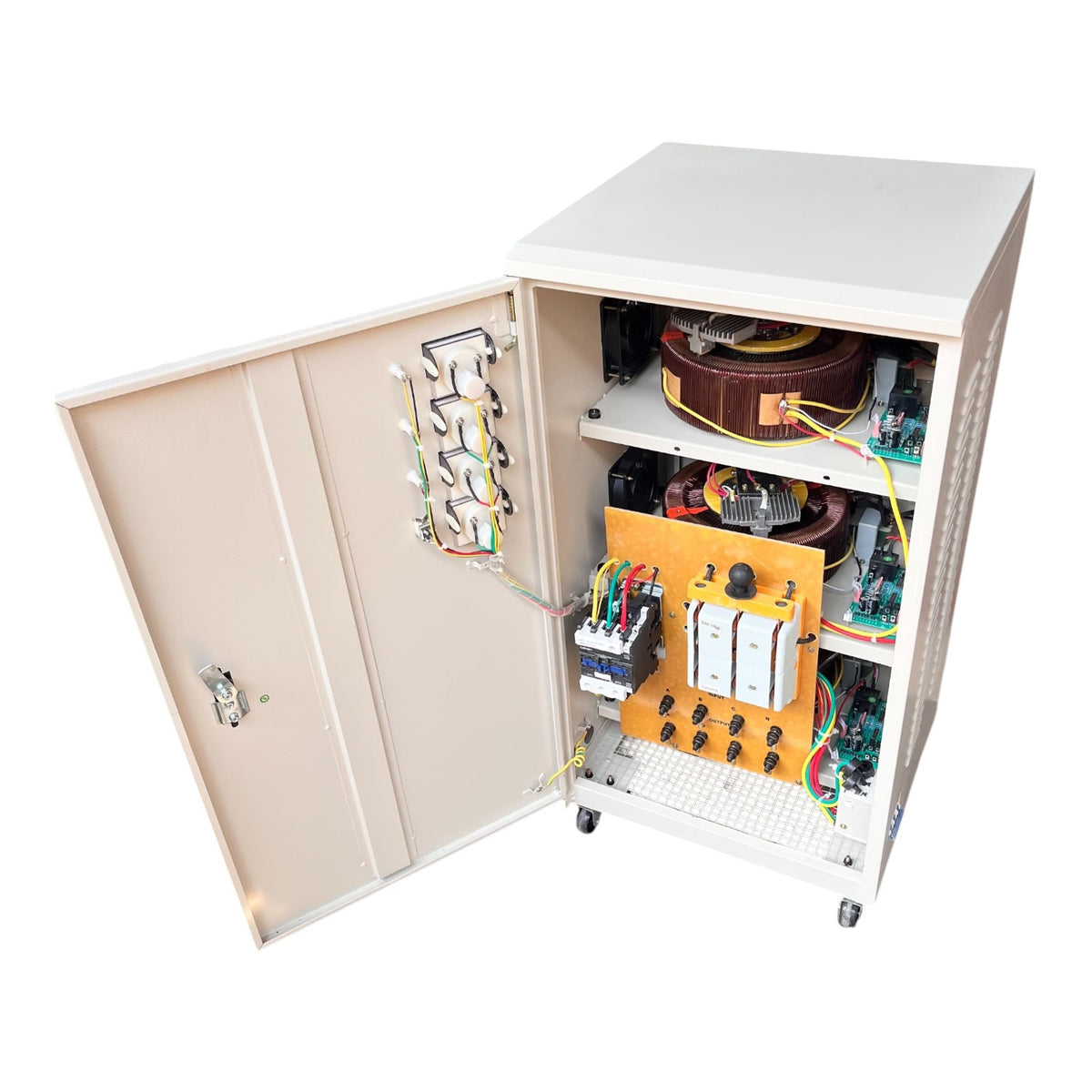 An open industrial electrical cabinet with beige exterior panels and a white interior frame, showing internal components including a large brown inductor, circuit breakers, wiring, and an orange control board on a white background.