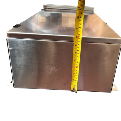Closed stainless steel NEMA 4X panel housing for Himel 500A MCCB with tape measure showing height.
