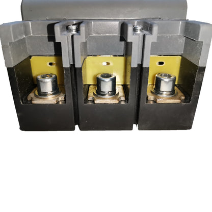 Three electrical contact blocks or terminals with black outer housings, yellow internal plates, and silver metal posts, shown against a plain white background.