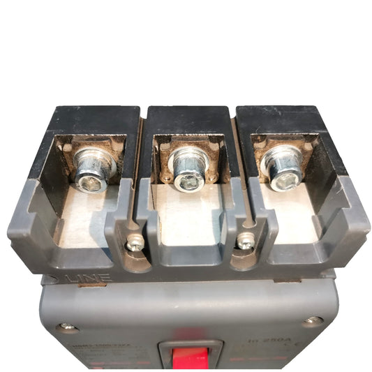A close-up of a three-terminal electrical contactor or switch component with metal screw terminals and a red switch lever on a gray housing, isolated on a white background.