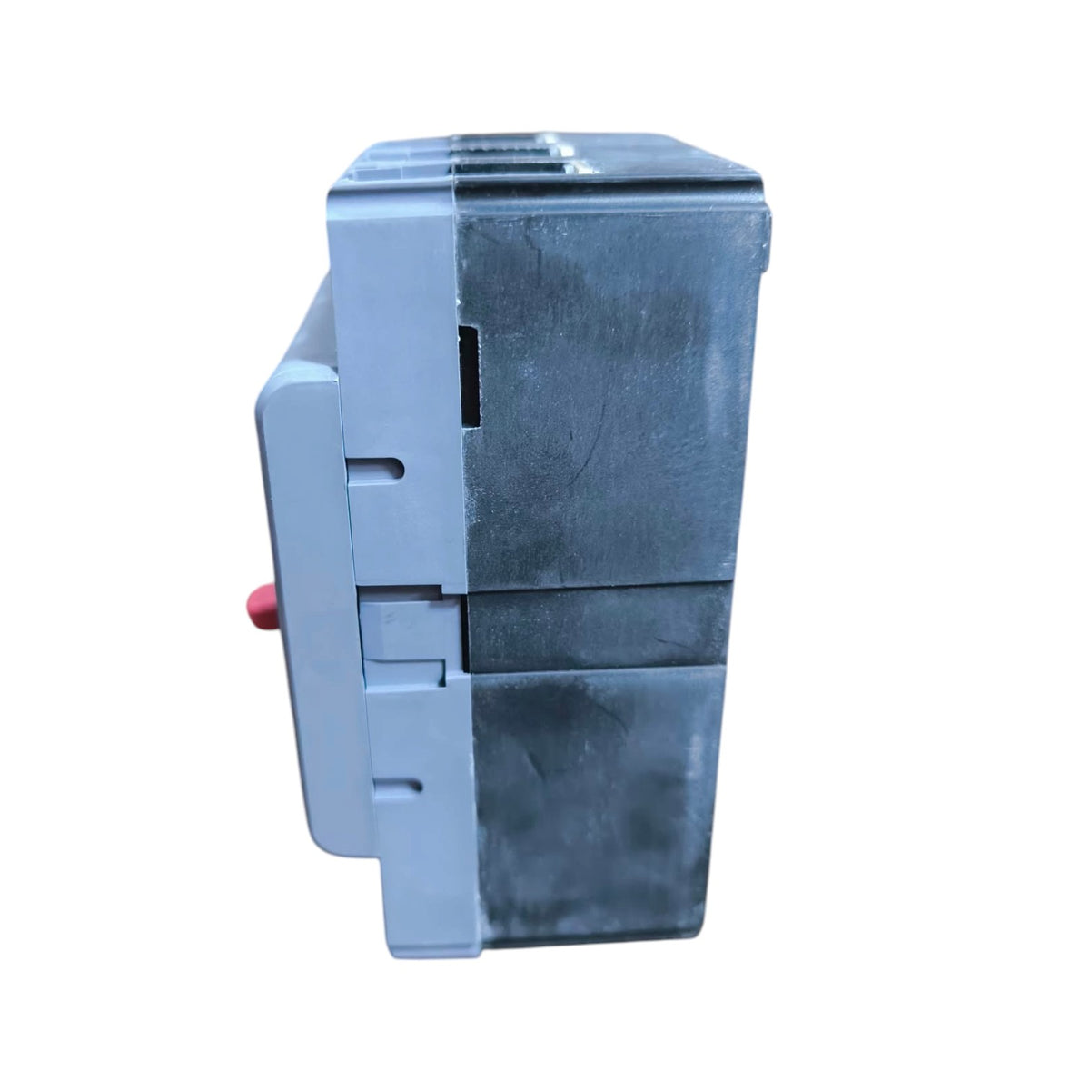 A gray plastic electrical component or switch module with a small red button on the side, shown against a plain white background.