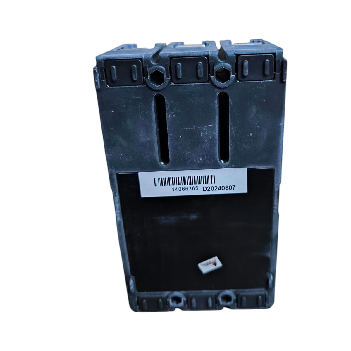 A black plastic electrical component or terminal block with a white barcode label on the front, photographed against a plain white background.